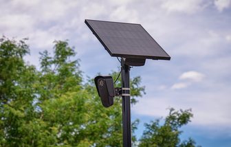 A Flock Safety automatic license plate reader camera on a pole.