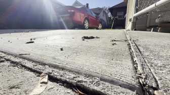 A concrete parking slab behind a Milwaukee home