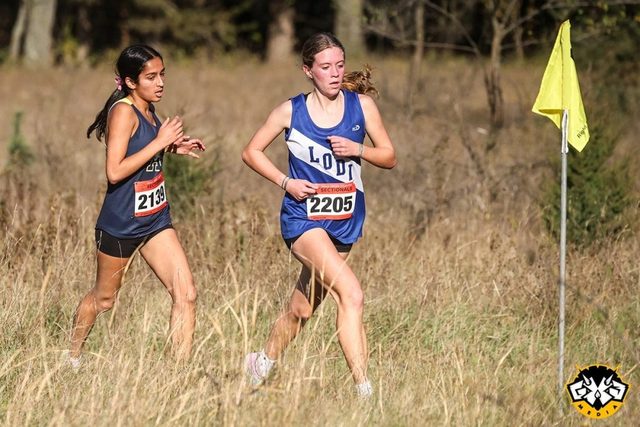 Lodi's Aubrey Schoenemann leads Aquinas' Sanjana Musafir during the WIAA Division 2 sectional race at Wyona Park