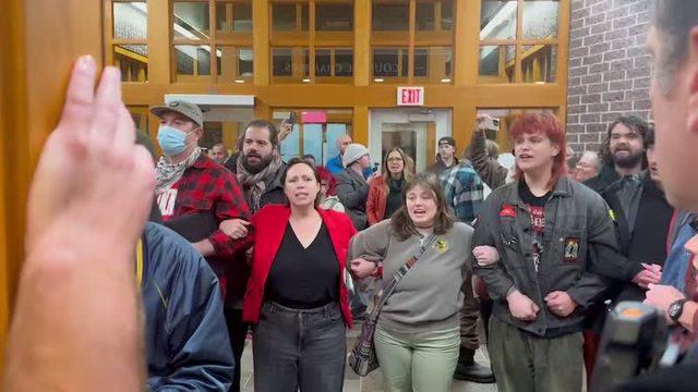 Protesters packed inside Hermantown City Hall during Monday night's council meeting