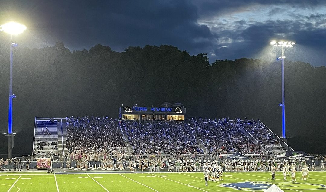 A high school football stadium under the lights