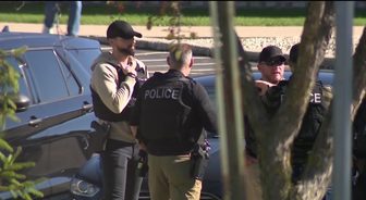 Officers gathered at the scene in Kenosha during the investigation into the Washington Road double homicide