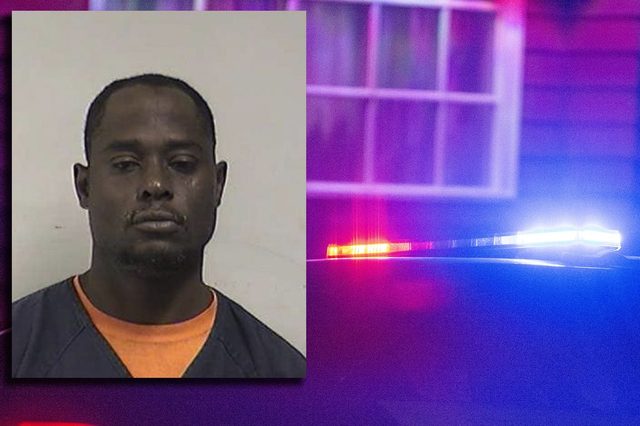 Booking photo of Darryal L. Jenkins shown alongside police lights