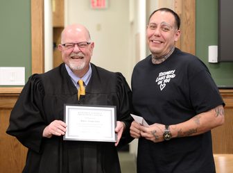 Judge David Wilk and Abel Sauceda at Sauceda's Kenosha County Treatment Court completion