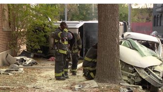 Firefighters at the scene of a crash near North 30th Street and West Center Street in Milwaukee
