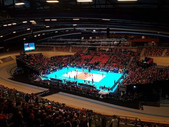A women's volleyball match in an arena