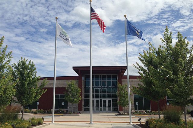 Village of Mount Pleasant Village Hall with flags in front