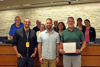 Cedar Hills Principal Matt Stollberg with Lead Pastor Caleb Widmer and Eric Berg of Harvest Church accepting the WASB Business Honor Roll recognition