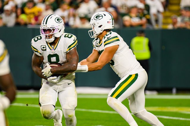 Green Bay Packers running back Josh Jacobs carrying the ball during a 2025 game at Lambeau Field