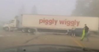 A Piggly Wiggly semi trailer in dense fog after an SUV struck its trailer at a Sheboygan County intersection