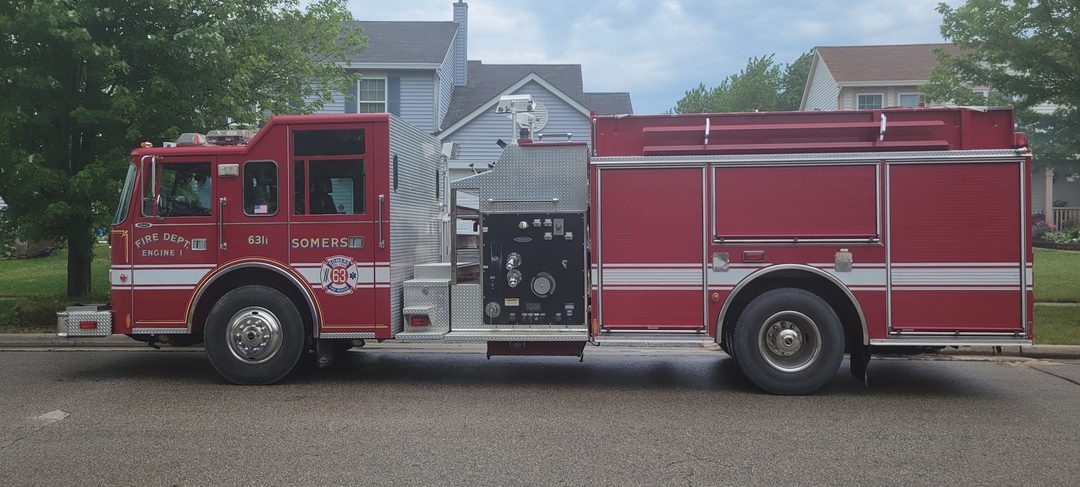 A Somers Fire Rescue fire truck parked on a residential street