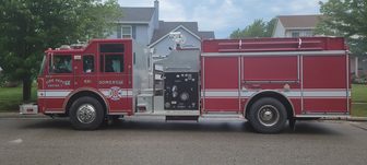 A Somers Fire Rescue fire truck parked on a residential street