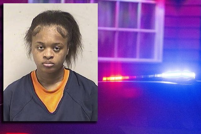 Booking photo of Jaraniyah J. Johnson beside police lights
