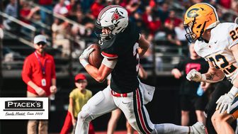 A UW-River Falls player runs with the ball against UW-Eau Claire at Ramer Field