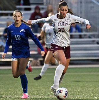 Macy Evans dribbling the ball for UW-La Crosse
