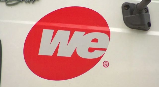 The We Energies logo on a company vehicle