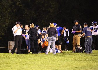A high school football game under the lights