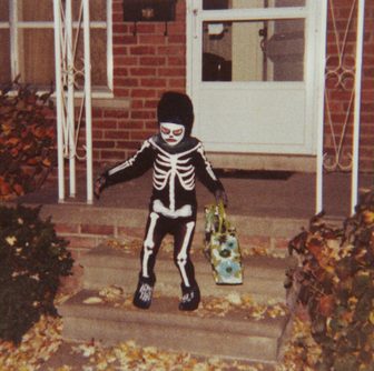 A child in a Halloween costume trick-or-treating
